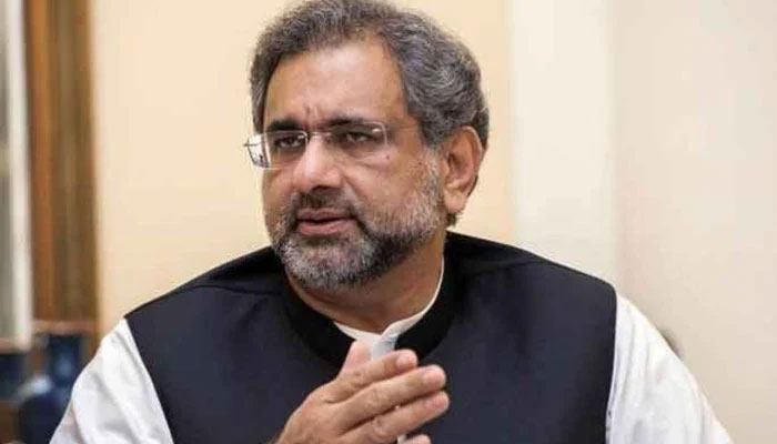Former prime minister Shahid Khaqan Abbasi gestures while talking to the media. — APP/File