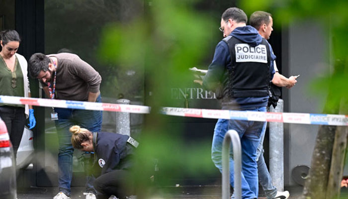 Police officers are at work on the site of a shooting that occured overnight during a wedding party in Thionville, eastern France, on June 30, 2024. — AFP