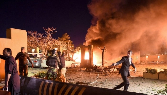 A representational image of security personnel and volunteers at the site of an explosion in Quetta. — AFP/File