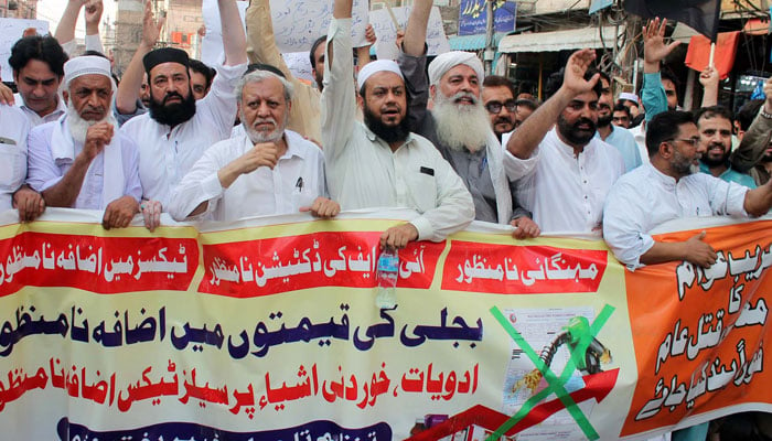 Traders of Peshawar are holding protest demonstration against prolonged electricity load-shedding and high-inflated electricity bills, at Ashraf road in Peshawar on Monday, July 1, 2024. — PPI