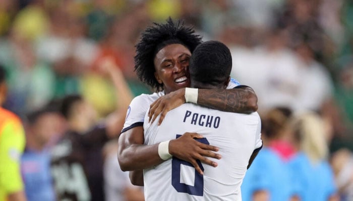 Ecuador defender Angelo Preciado left and team-mate Willian Pacho celebrate their passage to the Copa America quarter-finals. — AFP/file