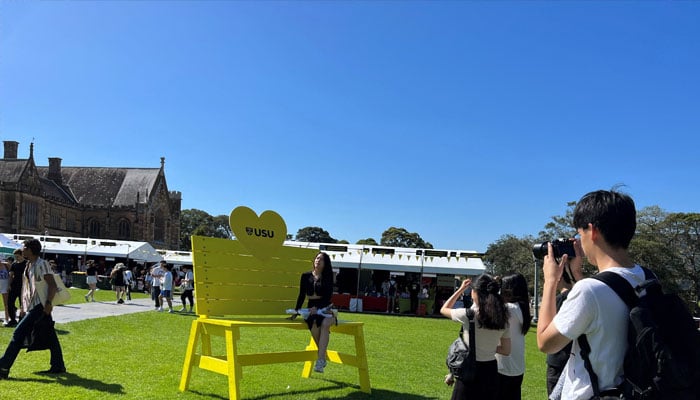 A girl poses for a picture during the orientation week at The University of Sydney, in Camperdown, Australia February 15, 2023. — Reuters