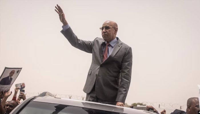 Mohamed Ould Cheikh El Ghazouani, president of Mauritania and leader of the Union for the Republic, waves to supporters celebrating his reelection in Nouakchott on July 01, 2024.— AFP