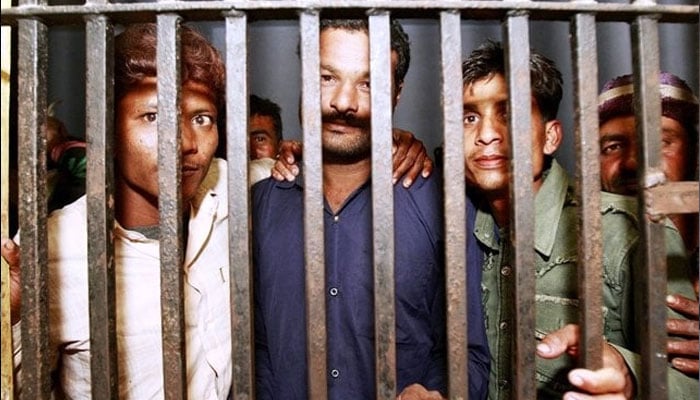 Prisoners seen behind bars in this image. — Reuters/file