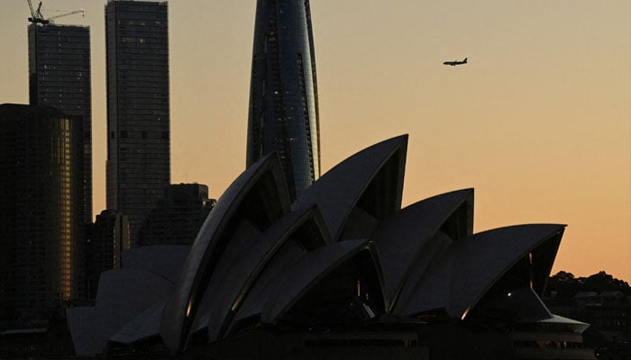 A plane flys over the Sydney Opera House, in Sydney, Australia, May 14, 2024. — Reuters
