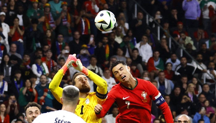 Slovenias Jan Oblak in action with Portugals Cristiano Ronaldo at Frankfurt Arena, Frankfurt, Germany on July 1, 2024 .— Reuters