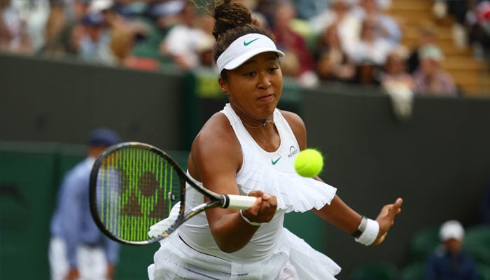 Japans Naomi Osaka in action during her womens singles first round match against Frances Diane Parry at All England Lawn Tennis and Croquet Club, London, Britain on July 1, 2024.— Reuters