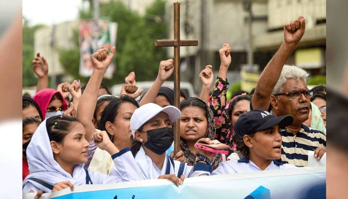 Pakistan minority rights campaigners protest the sentencing of a Christian man to death for sharing an allegedly blasphemous TikTok post, in Karachi on July 2, 2024. — AFP