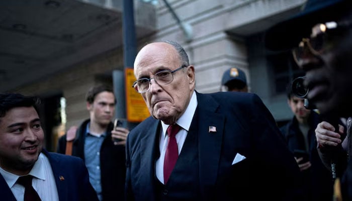 Former New York Mayor Rudy Giuliani departs the US District Courthouse after he was ordered to pay $148 million in his defamation case in Washington, US on December 15, 2023. — Reuters