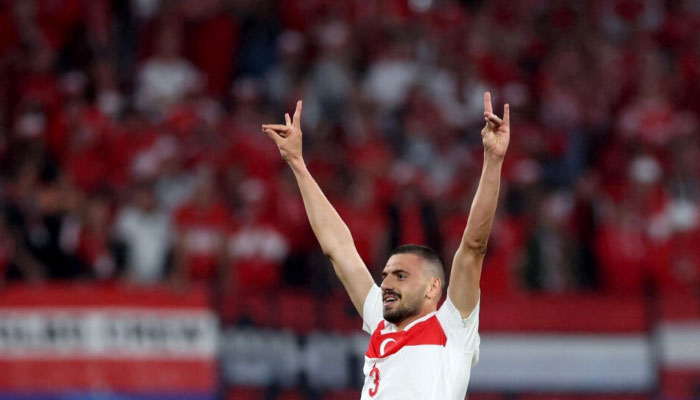 Turkey defender Merih Demiral makes a wolf salute sign that is commonly associated with a far-right Turkish nationalist group after scoring a goal.— AFP/File