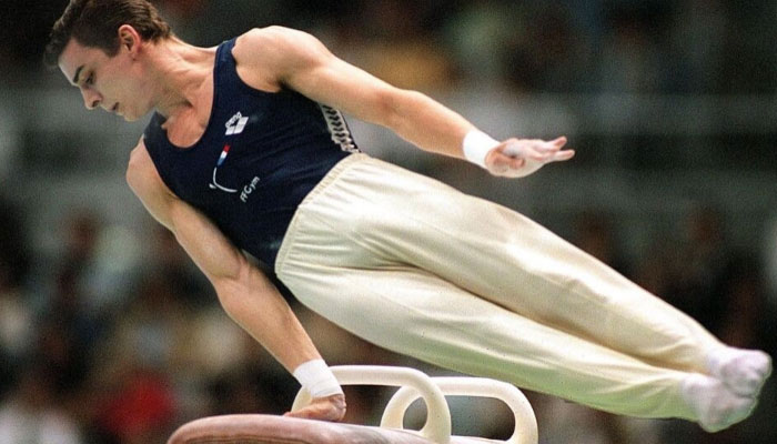 French gymnast and 2000 Olympic silver medallist Eric Poujade (late) performing a manoeuvre in this undated image. — AFP/file