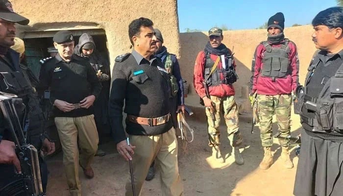A KP Police official interacts with police personnel during a visit to an undisclosed area on January 10, 2024. — Facebook/Khyber Pakhtunkhwa Police