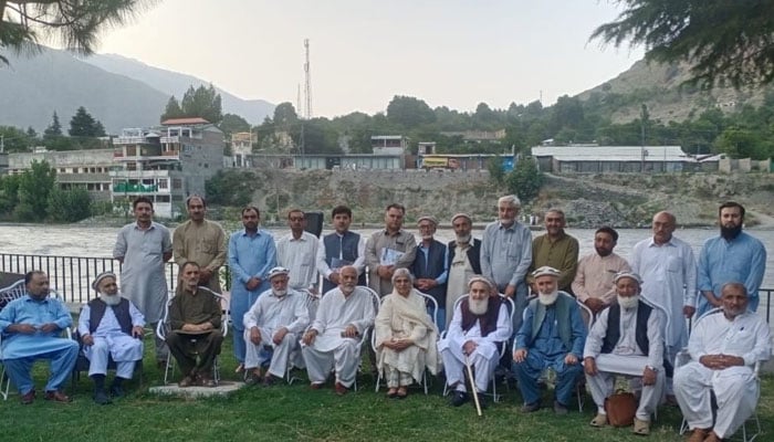 Pakistan Academy of Letters (PAL) Chairperson Dr Najeeba Arif with others poses for a group photo at a literary function arranged on the bank of the Chitral River on July 3, 2024. — Facebook/Pakistan Academy of Letters