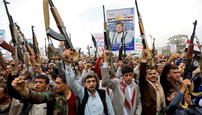 Yemens Huthi rebels raise slogans during a march in capital Sanaa.— AFP/File
