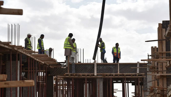 In this representative image showing workers at a construction site. — AFP/File