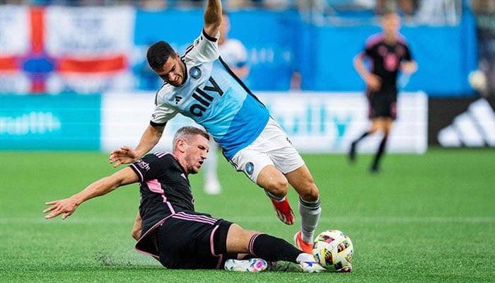 Serhiy Kryvtsov of Inter Miami tackles Liel Abada of Charlotte FC in the first half during their game at Bank of America Stadium on July 03, 2024 in Charlotte, North Carolina. — AFP
