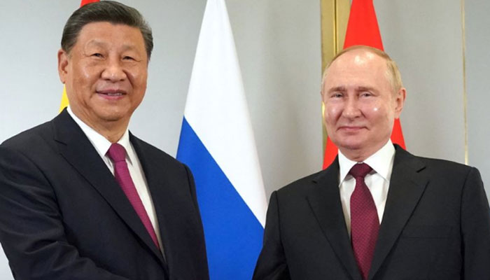 Russias President Vladimir Putin meets with Chinas President Xi Jinping on the sidelines of the Shanghai Cooperation Organisation (SCO) member states leaders summit in Astana on July 3, 2024. — AFP