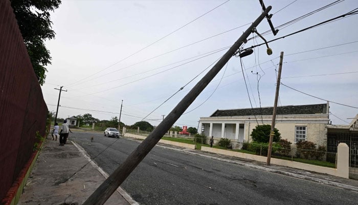 A light pole leans out of its foundation at National Heroes Park in Kingston, Jamaica, in the aftermath of Hurricane Beryl on July 4,2024. — AFP