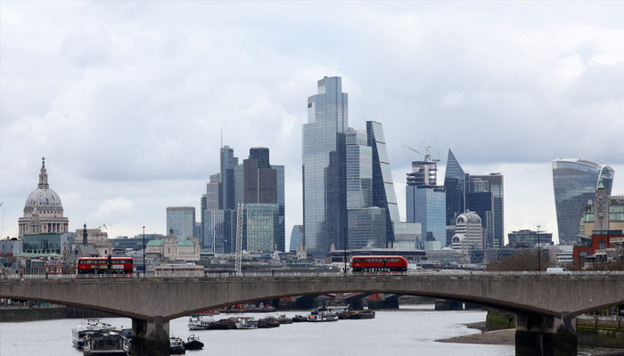 Buses cross Waterloo Bridge with the City of London financial district seen behind, in London, Britain, March 5, 2024. — Reuters