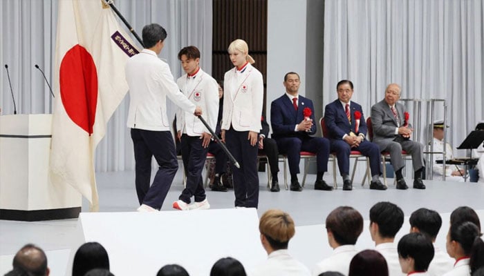 Flagbearers for the opening ceremony of the 2024 Paris Olympic Games, world sabre fencing champion Misaki Emura (right) and breakdancer Shigeyuki Shigekix Nakarai (centre), attend the Japanese delegations launch ceremony in Tokyo. — AFP/File