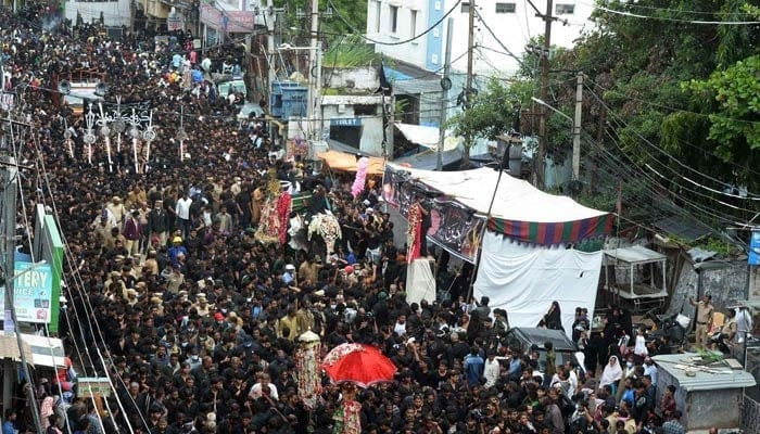 Mourners participate in the procession on the tenth day of Ashura during the Islamic month of Muharram. — AFP/File