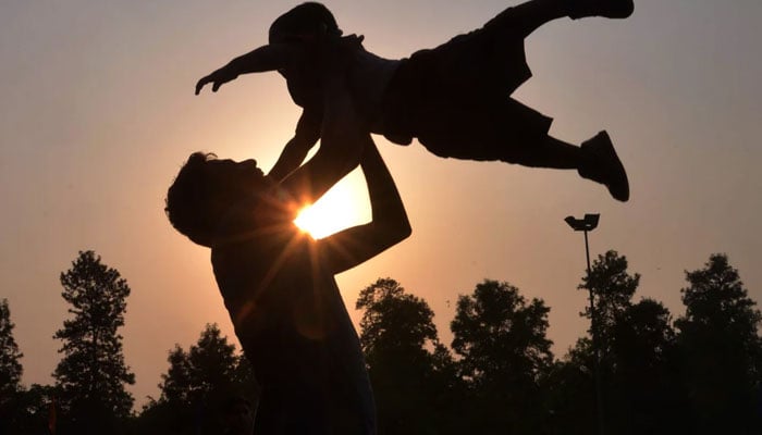 This representational image shows a father playing with his child. — AFP/File