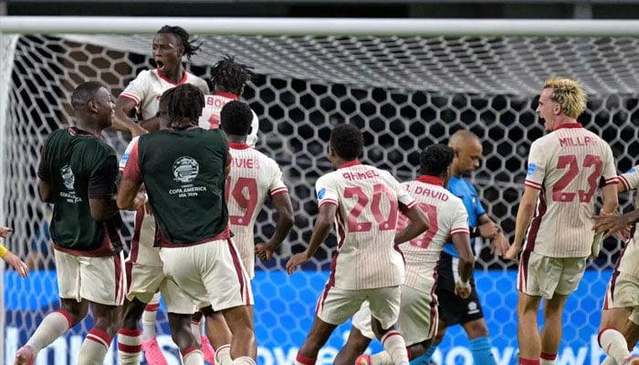 Canada’s players celebrate their victory after a penalty shoot-out in the 2024 Copa America tournament quarter-final football match between Venezuela and Canada at AT&T Stadium in Arlington, Texas, on July 5, 2024. — AFP