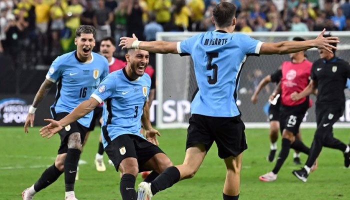 Uruguays midfielder #05 Manuel Ugarte celebrates after scoring in a penalty shoot-out to win the Conmebol 2024 Copa America tournament quarter-final football match between Uruguay and Brazil at Allegiant Stadium in Las Vegas, Nevada on July 6, 2024. — AFP