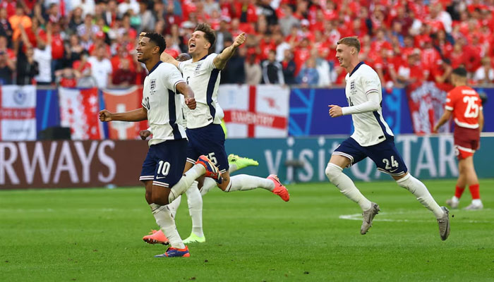 Englands Jude Bellingham, John Stones and Cole Palmer celebrate after winning the penalty shootout at Dusseldorf Arena, Dusseldorf, Germany on July 6, 2024. — Reuters