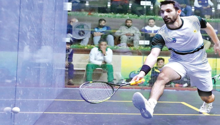 Pakistans Nasir Iqbal in action during his Asian Individual Squash Championship quarter-final against Leung Chi Hin Henry of Hong Kong at the Mushaf Squash Complex. — APP/File