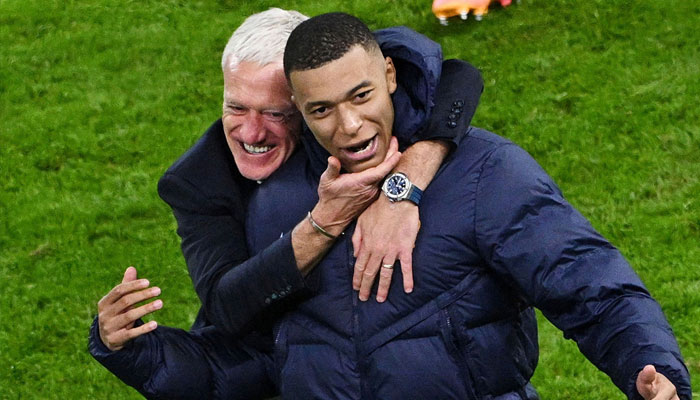 France coach Didier Deschamps celebrates with Kylian Mbappe after winning the penalty shootout at Hamburg Volksparkstadion, Hamburg, Germany on  July 5, 2024. — Reuters