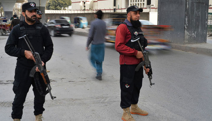 Peshawar Police personnel stand guard in the provincial capital of KP. — AFP/File