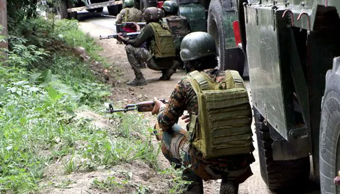 Indian Army soldiers stand guard at a site in Kulgam. — ANI/file