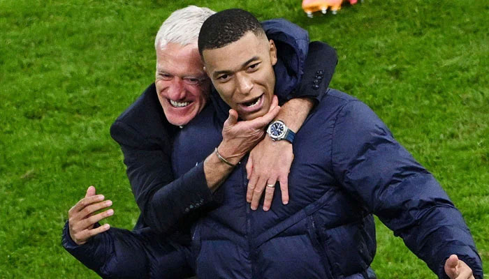 France coach Didier Deschamps celebrates with Kylian Mbappe after winning the penalty shootout at Hamburg Volksparkstadion, Hamburg, Germany on July 5, 2024. — Reuters