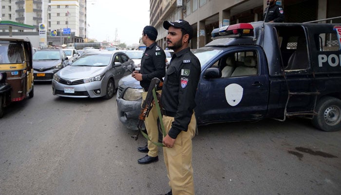 Security officials stand alert in Karachi on July 8, 2024. — PPI