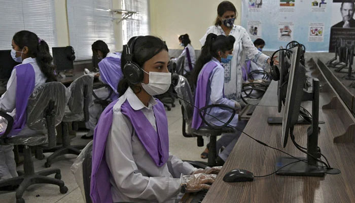 In this representational image, students attend a computer class at the Islamabad Model College of Commerce for Girls in Islamabad. — AFP/File