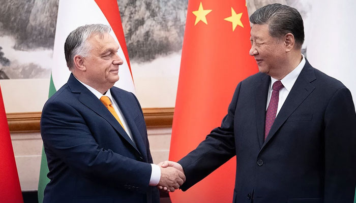 Chinese President Xi Jinping (right) shakes hands with  Hungarian Prime Minister Viktor Orban. — AFP/File