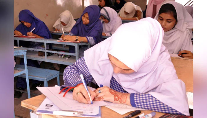 Students of matric class solving paper in examination center during Annual Examination of Matriculation on May 11, 2024. — PPI