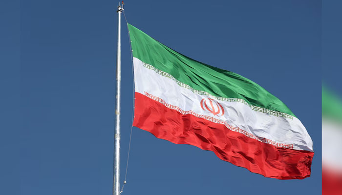 The Iranian flag is seen flying over a street in Tehran, Iran, February 3, 2023. — Reuters