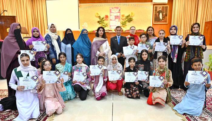 CEO International Governance and Sustainability Institute Dr Sultan Azam Temuri in a group photograph with students during the closing ceremony of the Summer Fiesta Program at IMCG F-7/4 on July 9, 2024. — APP