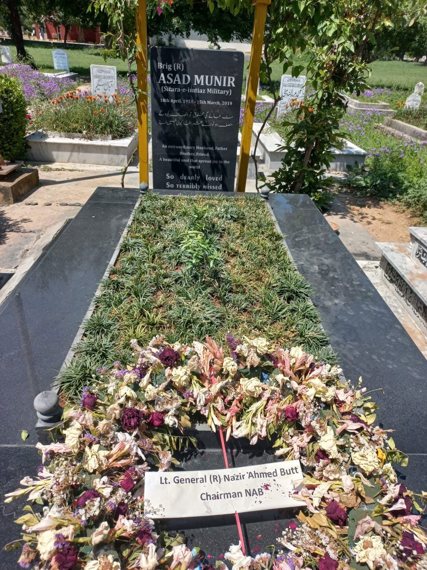 A floral wreath can be seen at the grave of Brig (retd) Asad Munir. — Reporter