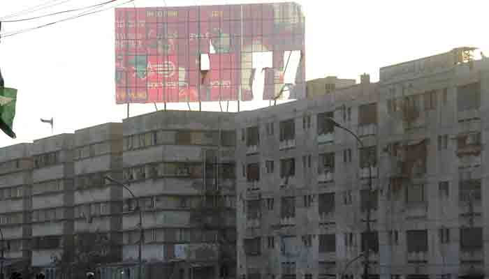 A view of damaged billboard due to heavy dust storm that hit Karachi. — Online/File