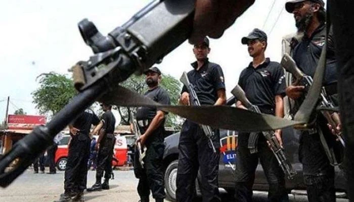 Police personnel stand guard in Karachi. — geo tv /File