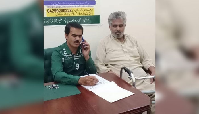 This representational image shows a member of the district welfare and rehabilitation unit registration for persons with disabilities in district Gujrat on July 1, 2024. — Facebook/Parcham Welfare Foundation Pakistan