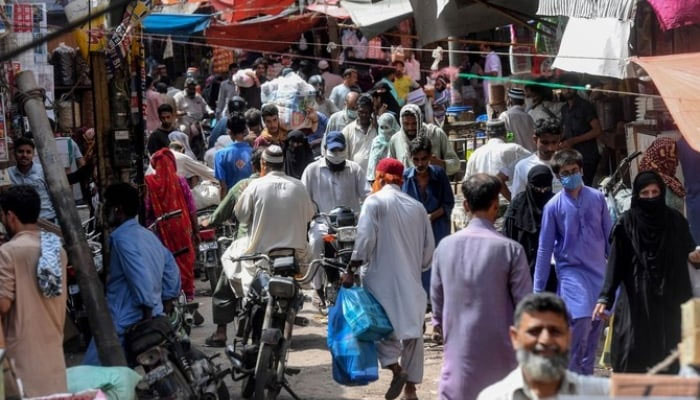 Residents shop at a wholesale market in Karachi, Pakistan on June 10, 2020. —AFP