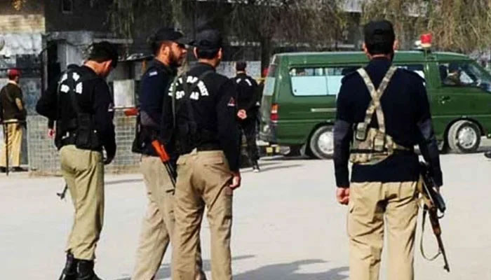 Police personnel stand guard on the road. — AFP/File