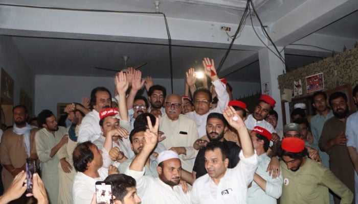 ANP leader Mian Iftikhar Hussain pictured with party workers celebrating their by-election win in PK-22 constituency in Bajaur, Khyuber Pakhtunkhwa in this image released on July 12, 2024. — Facebook/Awami National Party