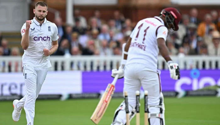 Englands Gus Atkinson celebrates the dismissal of West Indies captain Kraigg Brathwaite during opening day of the first Test Match at the Lords Cricket Ground, London on July 10, 2024. — AFP