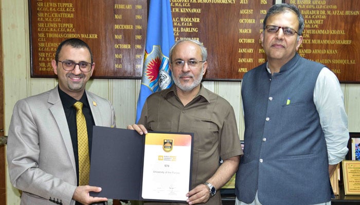 Punjab University Vice Channcellor Professor Dr Khalid Mehmood is giving Certificate to Regional Manager of QS for Arab-Middle East, South Asian region Rami Awad and Chairman Ranking Committee Dr Usman Awan present. — APP/file