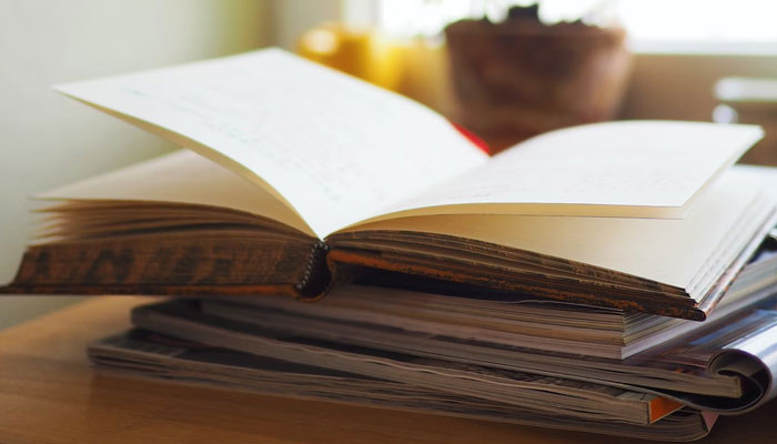 This representational image shows a book on the table. — Unsplash